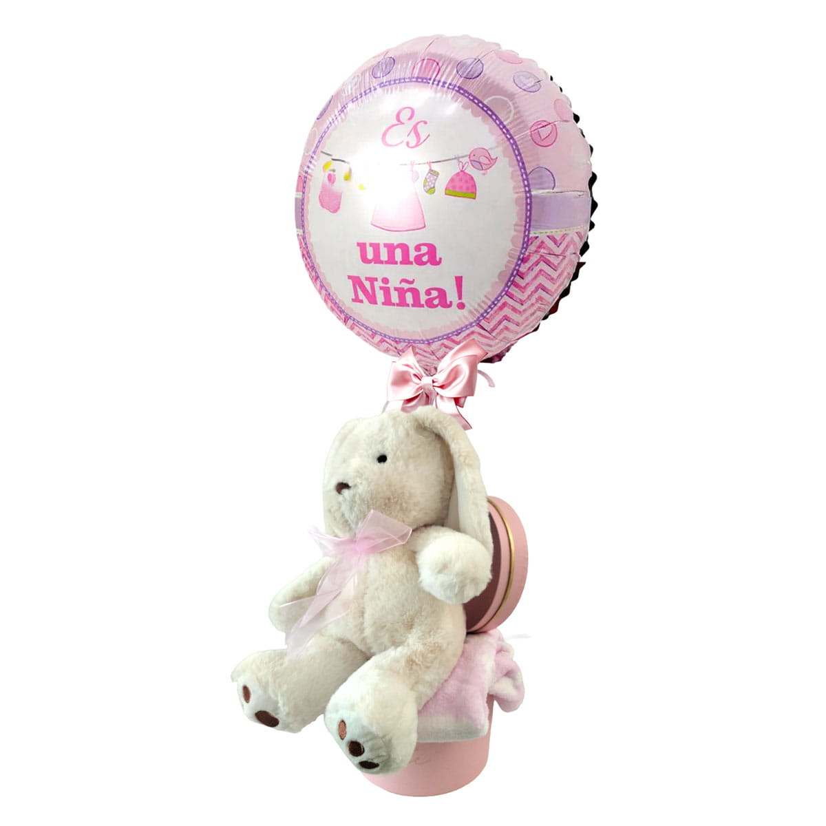 Arreglo de globo para baby showe tema de niña con peluche sobre una colchita